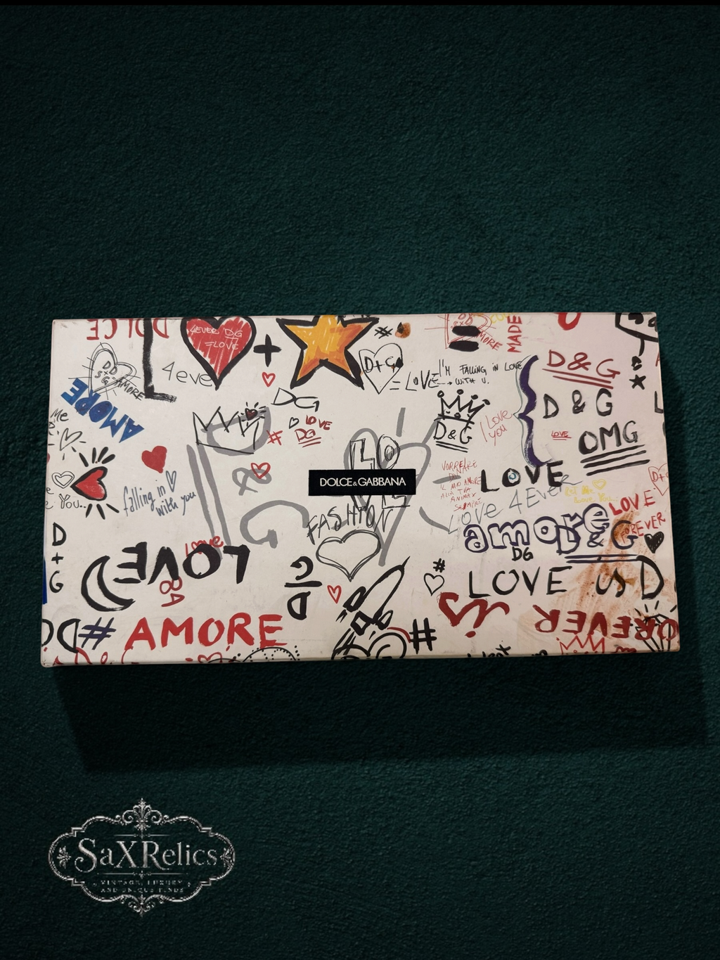 Dolce & Gabbana embellished slide sandals box with graffiti-style art, featuring 'Love' and 'Amore' text, hearts, and stars.