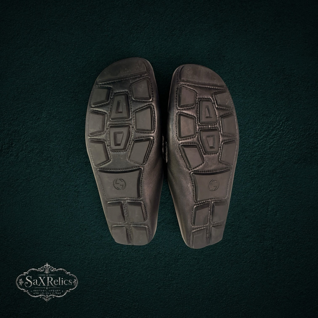 My Store Gucci black leather loafers featuring a durable rubber-pebble outsole for traction and comfort.