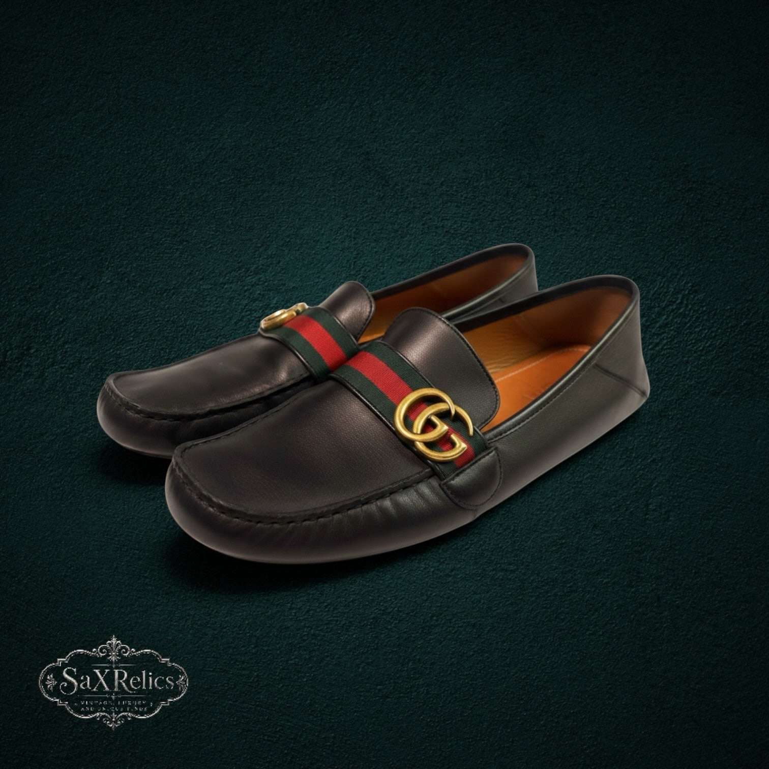 My Store Gucci black leather loafers featuring signature web stripe and gold-tone interlocking GG hardware.