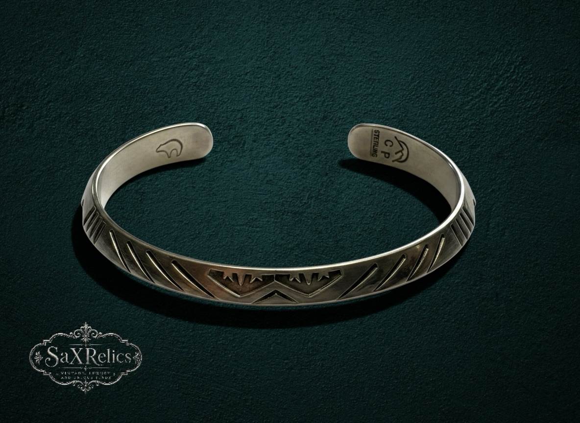 My Store handcrafted sterling silver cuff bracelet with intricate geometric engravings and vintage-inspired design.