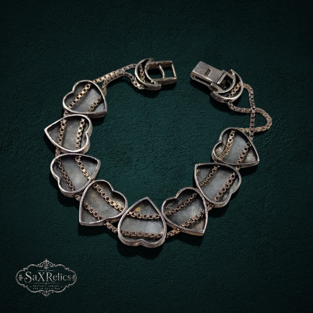 My Store SAXRelics vintage silver-tone heart link bracelet with delicate double chain detailing and decorative clasp.