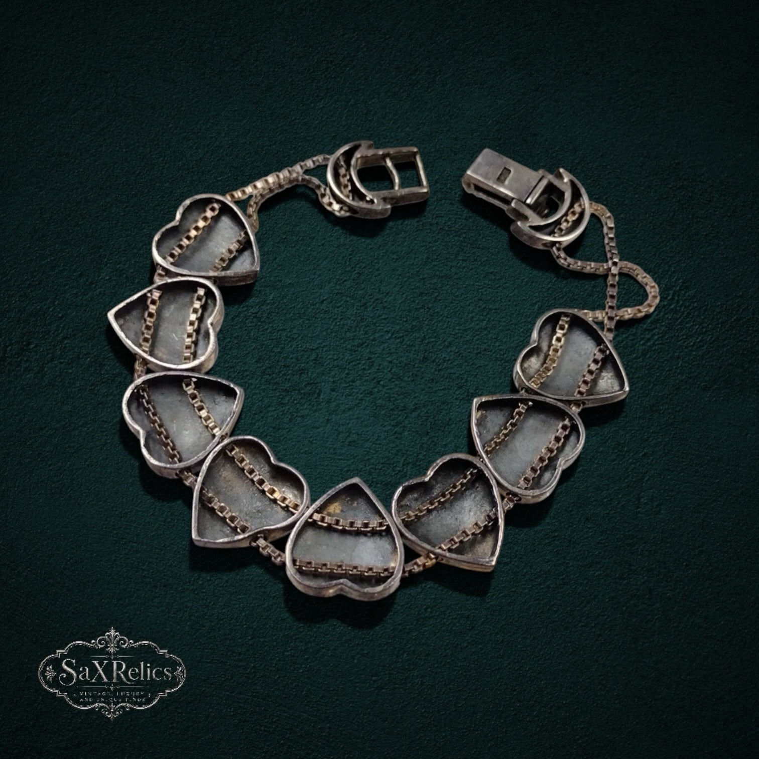 My Store SAXRelics vintage silver-tone heart link bracelet with delicate double chain detailing and decorative clasp.