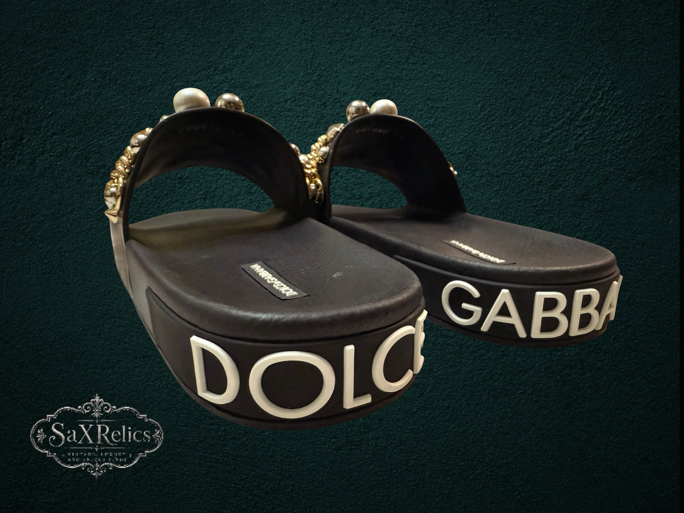 My Store Dolce & Gabbana black rubber slide sandals with pearl and gold-tone embellishments on straps and embossed logo on platform sole.